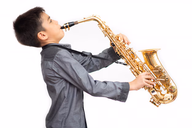 little-asian-musician-boy-playing-saxophone_43400-426